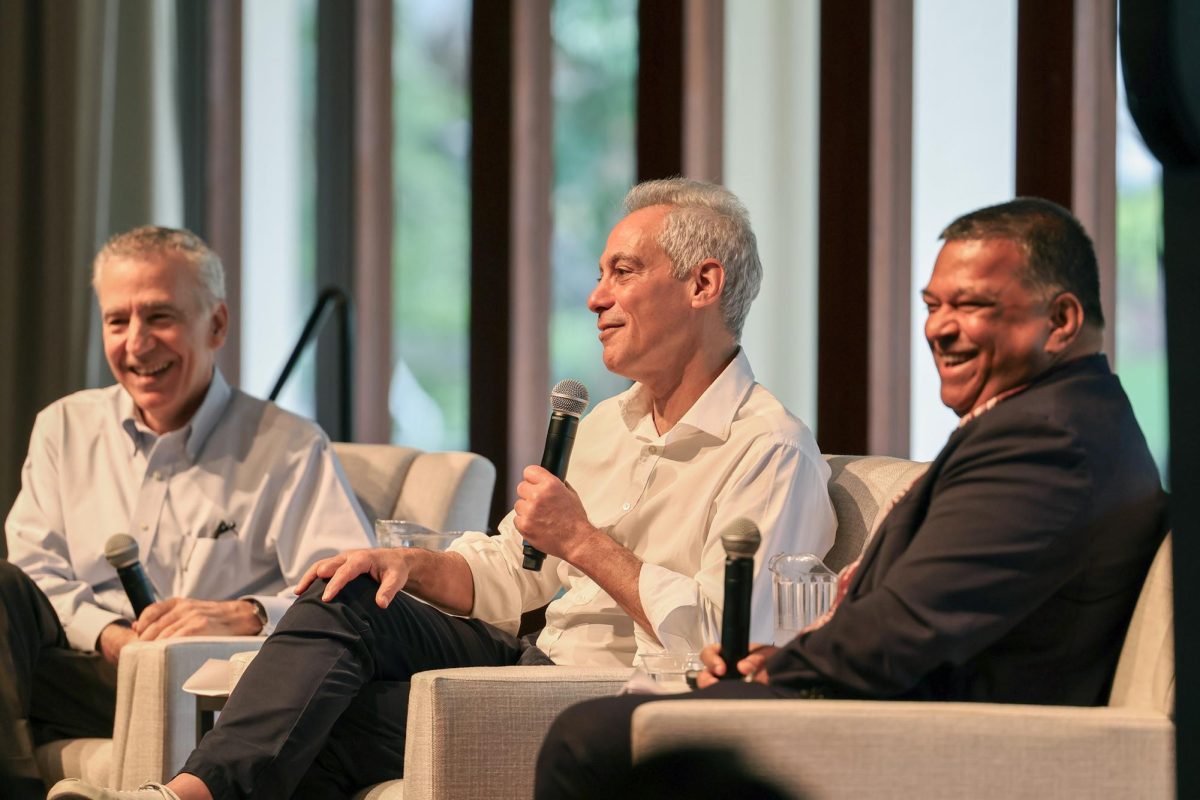 The panelists, from left to right, Goldberg, Emanuel and Limaye, share a laugh. 