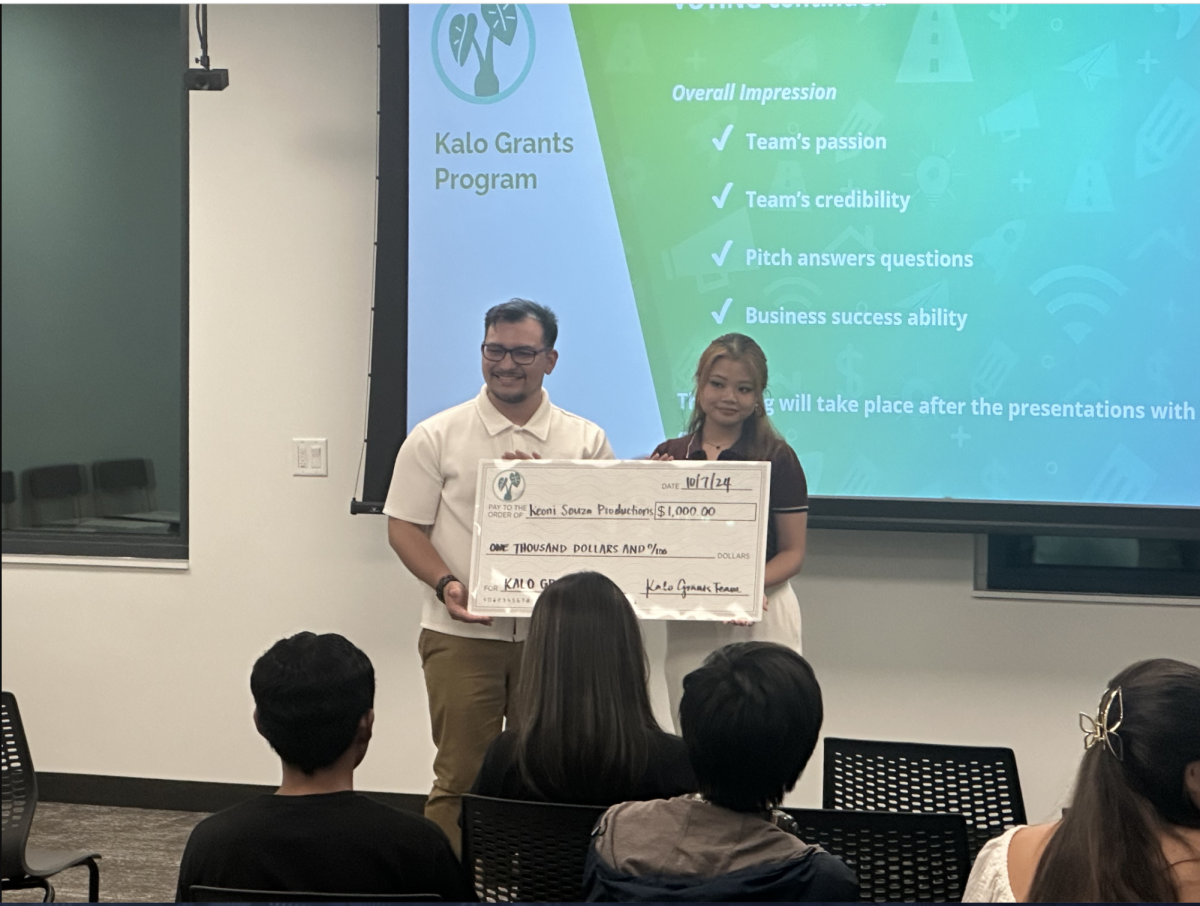 Nicholas Souza and Jasmine Thai receive the Kalo Grant after live pitch.