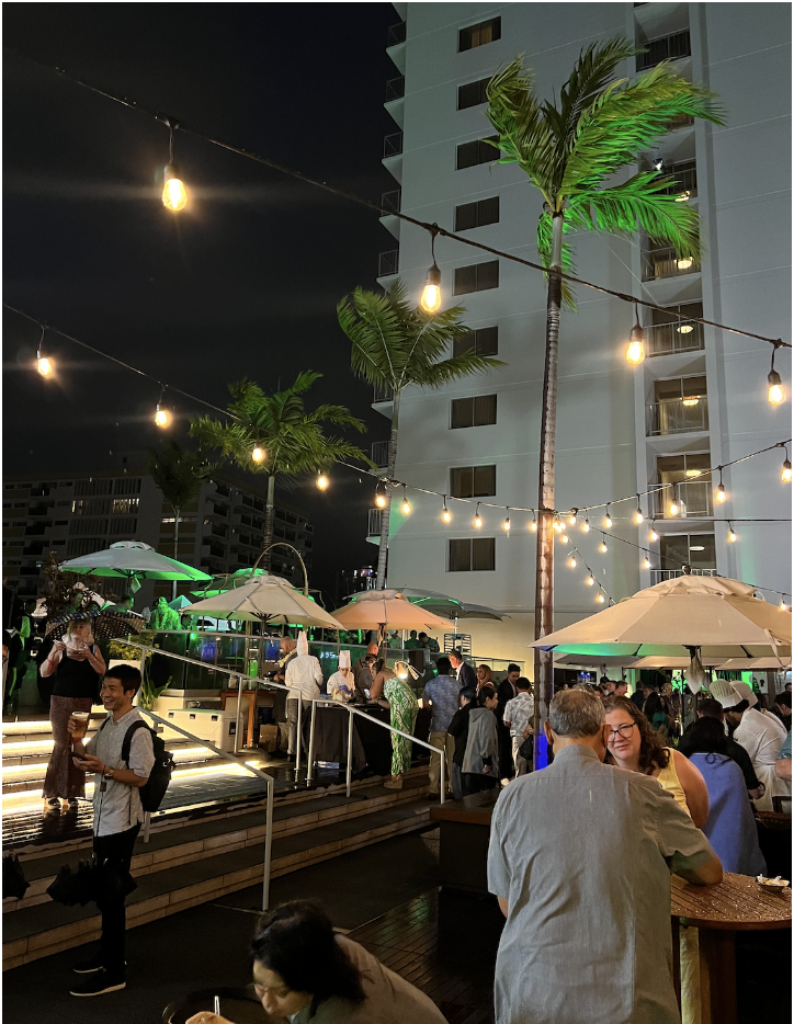 Guests gather on a rooftop bar for the Hawaii Food and Wine Festival's Jade Cocktail club event.