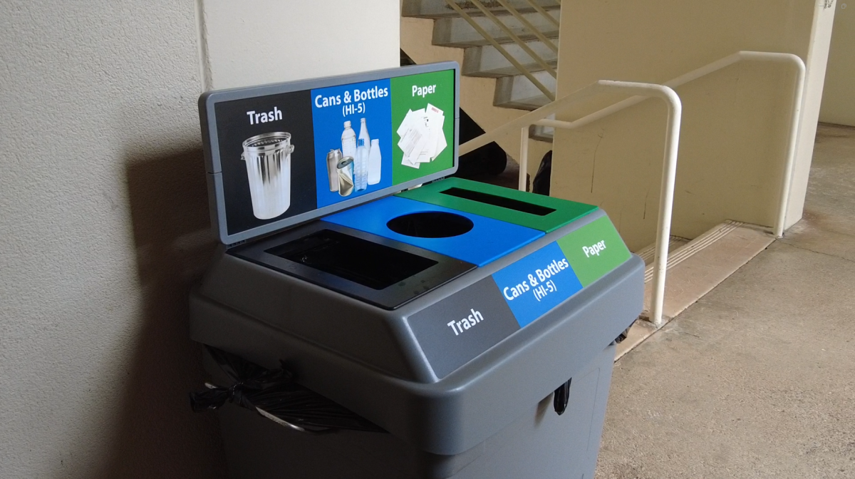 A tri-stream bin beside Webster Hall on the UH Mānoa campus, offering separate sections for trash, recyclables, and compost - one of the many types of bins across campus to encourage sustainable practices.