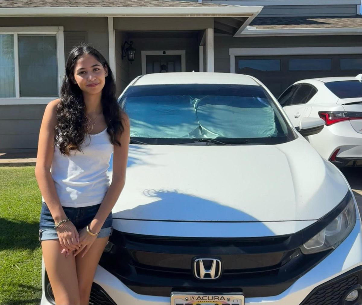 UH Mānoa student Alessia Loperfido, standing next to her car