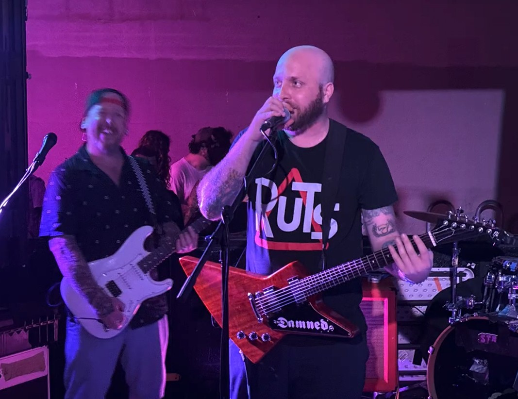 Lead guitarist Johnny Random of Smitz fires up the crowd for Homie Fest 2025 at Proof Social Club.