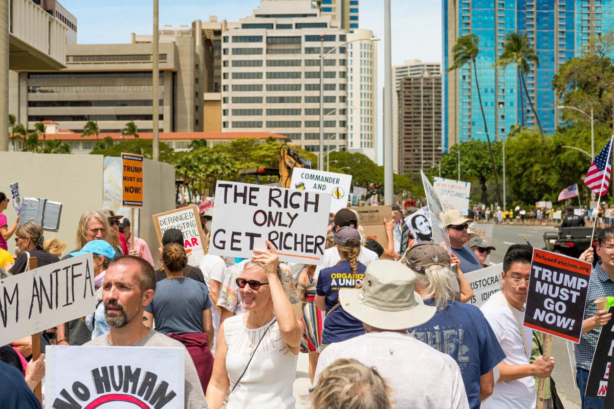 Scores of people took to the streets carrying signs on specific policies.