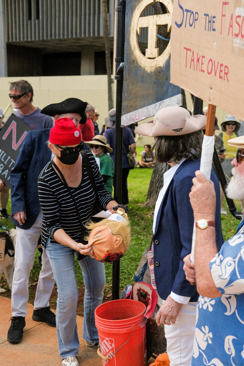 An effigy of a guillotine and President Trump’s head was upkept by demonstrators donning American Revolution attire.